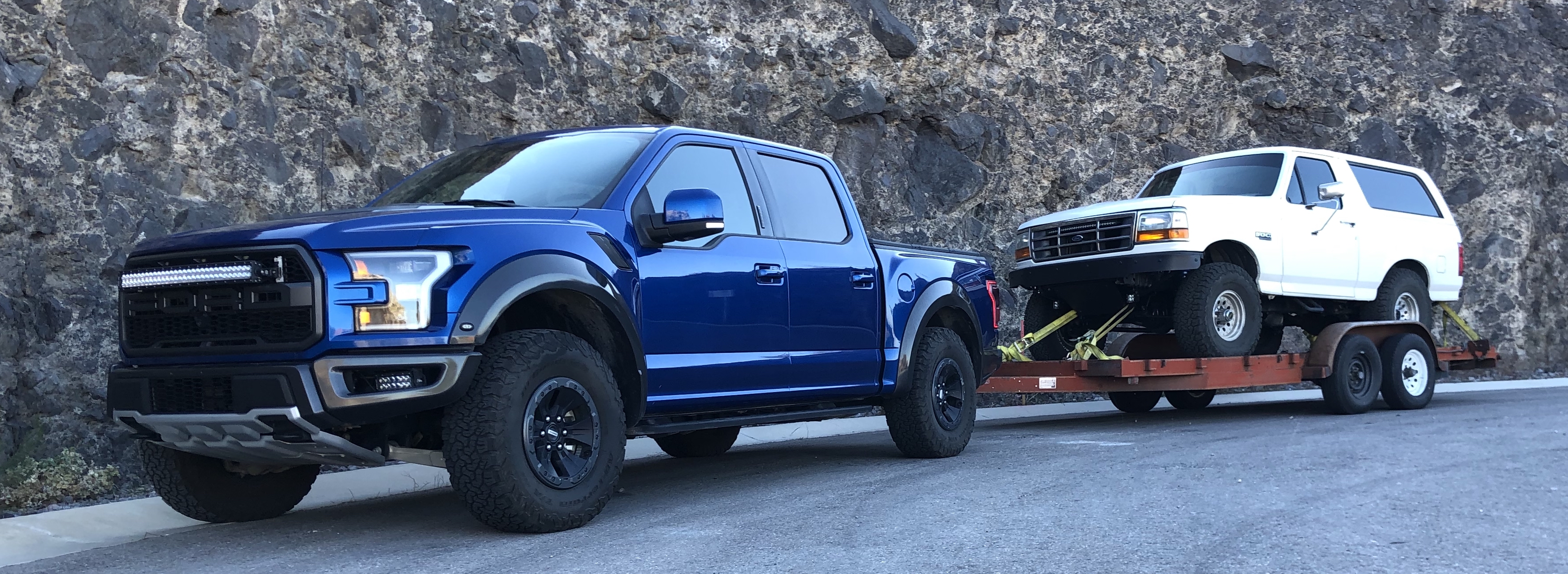 Ford Bronco trailered by Ford Raptor