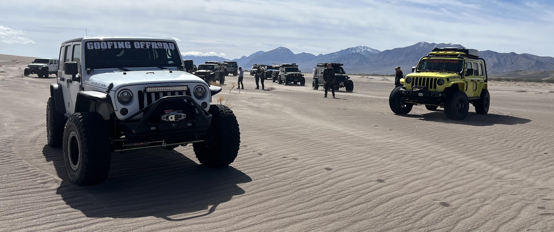 Jeeps overlanding on a sand dune